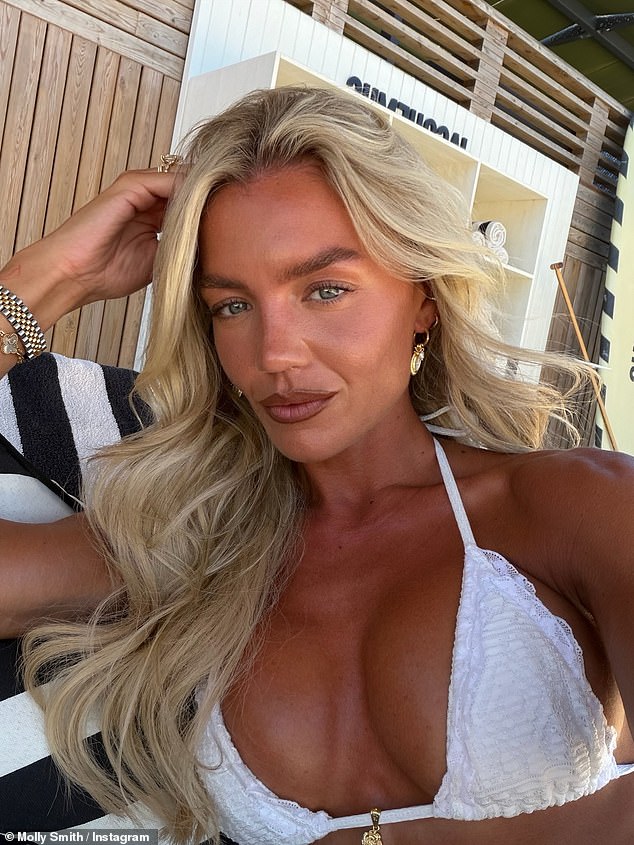 The reality star showed off her deep tan in bridal white swimwear during the trip to Bodrum, Turkey