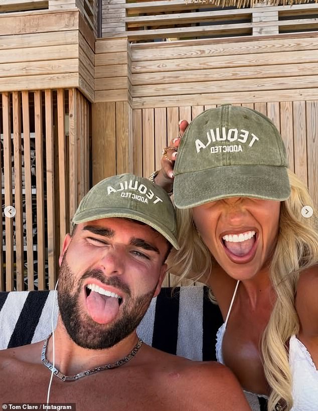 Another snap shared to his holiday album showed him and his new wife larking about for a fun selfie as they donned matching khaki caps with the word 'tequila' emblazoned across them