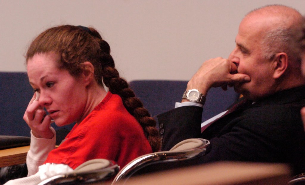 Christa Gail Pike crying while listening to a recording of herself confessing to murder.