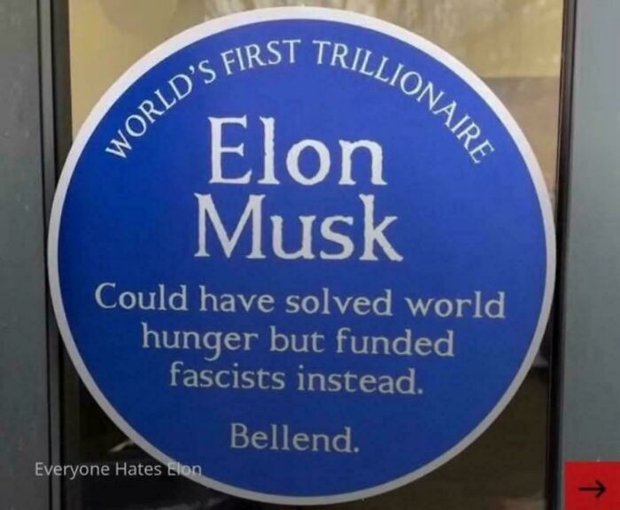 A sticker with text criticizing Elon Musk as the world's first trillionaire for failing to solve world hunger, an Eat The Rich moment. A sticker with text criticizing Elon Musk as the world's first trillionaire for failing to solve world hunger, an Eat The Rich moment.